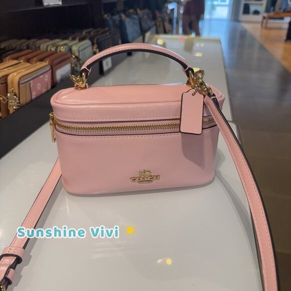 Coach Handbags - NWT Coach Rainer Crossbody Bag 18 CEO24 Gold/Soft Pink Shiny smooth leather
